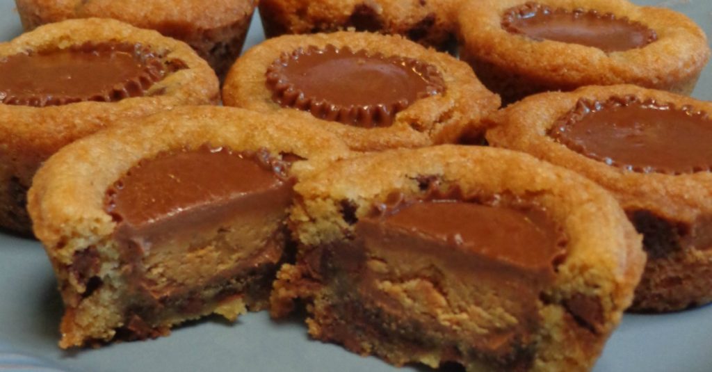 A close up of a piece chocolate chip peanut butter cup cookies
