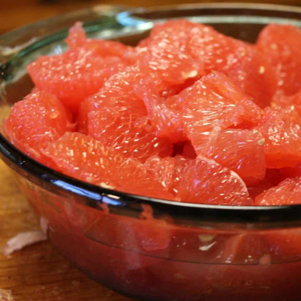 bowl with peeled and segmented grapefruit slices in it