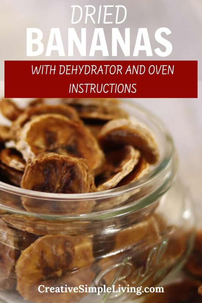 A glass jar filled with dehydrated bananas slices. Text reads: "DRIED BANANAS with dehydrator and oven instructions. CreativeSimpleLiving.com.