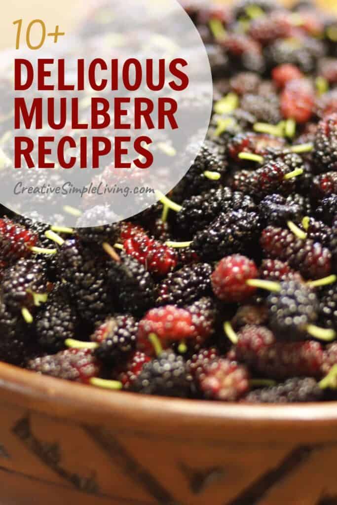 A close-up of a wooden bowl filled with fresh mulberries, overlaid with text reading "10+ Delicious Mulberry Recipes" and the website "CreativeSimpleLiving.com." Discover new mulberry recipes to try at home!.