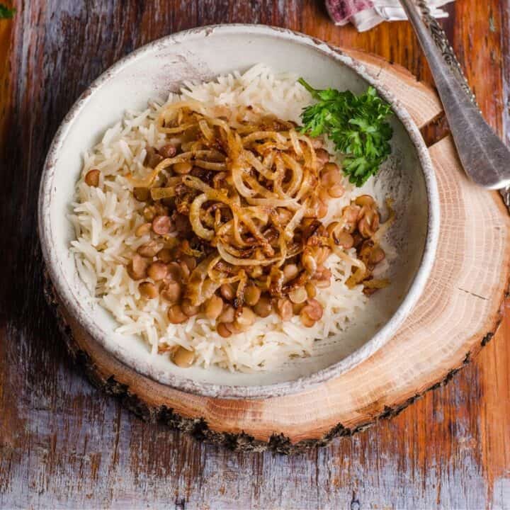bowl of lentils and rice on wood slab